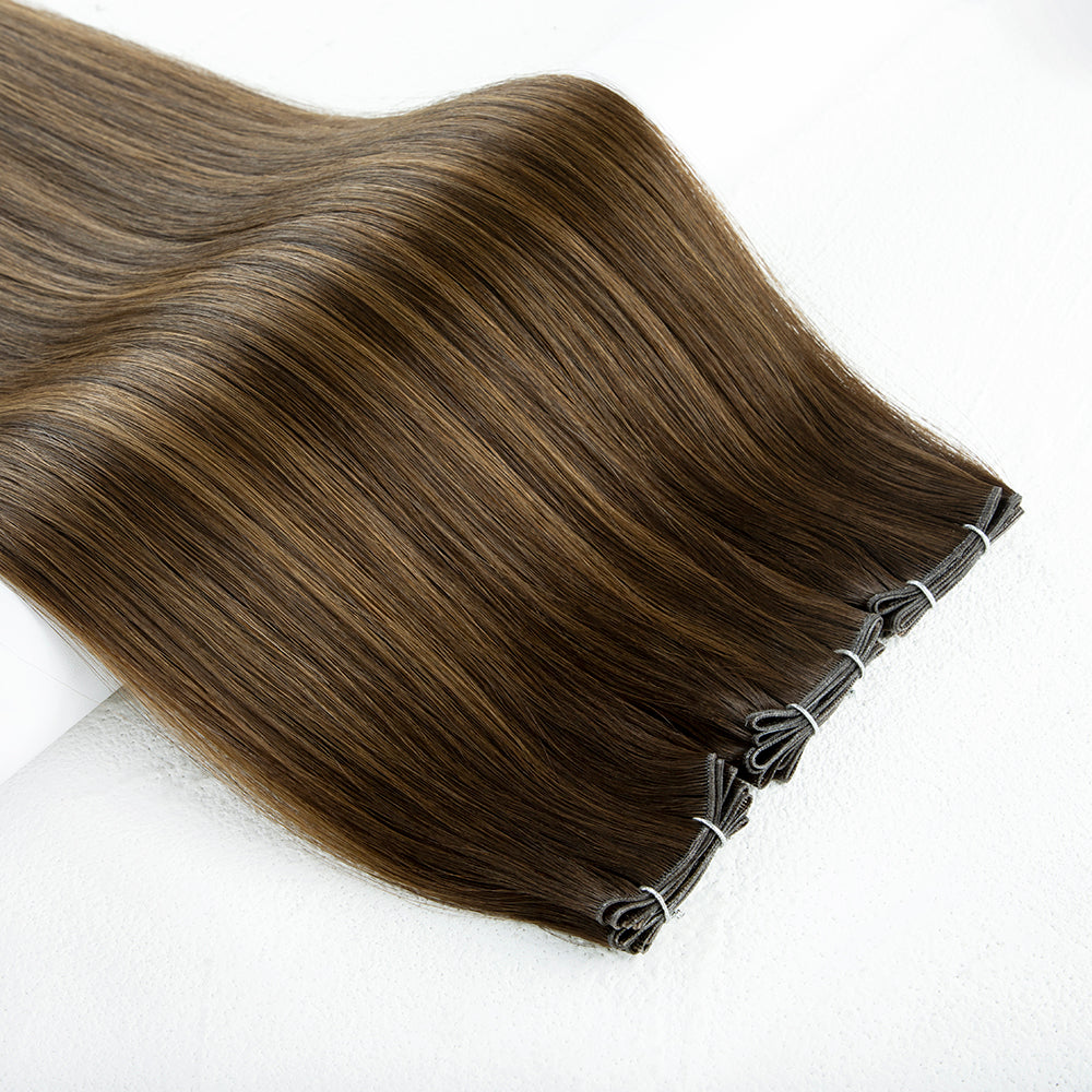 Brown hair extensions on a white background. salon quality hair xtensions